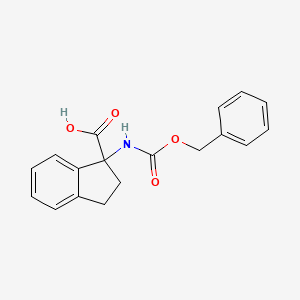 Chemical structure of 1-(((Benzyloxy)carbonyl)amino)-2,3-dihydro-1H-indene-1-carboxylic acid
