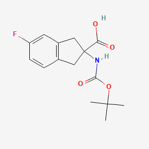Chemical structure of 2-((tert-Butoxycarbonyl)amino)-5-fluoro-2,3-dihydro-1H-indene-2-carboxylic acid
