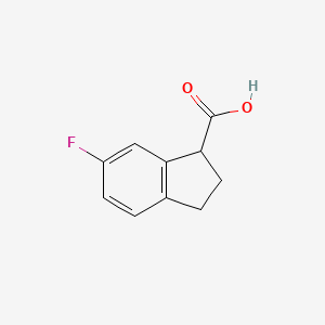 Chemical structure of 6-Fluoro-2,3-dihydro-1H-indene-1-carboxylic acid