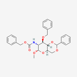Chemical structure of Benzyl ((4aR,6S,7R,8R,8aS)-8-(benzyloxy)-6-methoxy-2-phenylhexahydropyrano[3,2-d][1,3]dioxin-7-yl)carbamate