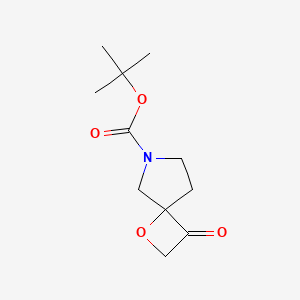 Chemical structure of tert-Butyl 3-oxo-1-oxa-6-azaspiro[3.4]octane-6-carboxylate