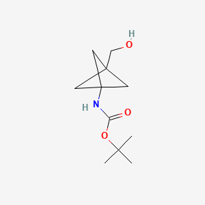 Chemical structure of tert-Butyl (3-(hydroxymethyl)bicyclo[1.1.1]pentan-1-yl)carbamate