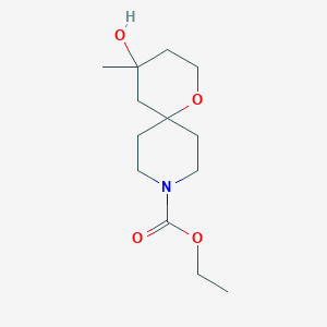 Chemical structure of ethyl 4-hydroxy-4-methyl-1-oxa-9-azaspiro[5.5]undecane-9-carboxylate