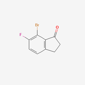 Chemical structure of 7-Bromo-6-fluoro-2,3-dihydro-1H-inden-1-one