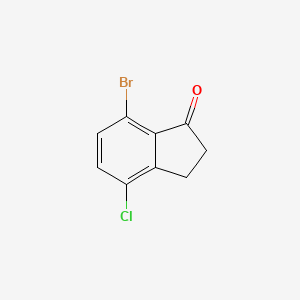 Chemical structure of 7-Bromo-4-chloro-2,3-dihydro-1H-inden-1-one