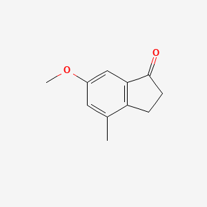 Chemical structure of 6-Methoxy-4-methyl-indan-1-one