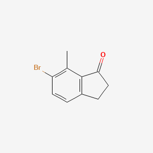 Chemical structure of 6-Bromo-7-methyl-2,3-dihydro-1H-inden-1-one