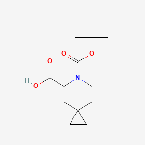 Chemical structure of 6-[(tert-Butoxy)carbonyl]-6-azaspiro[2.5]octane-5-carboxylic acid