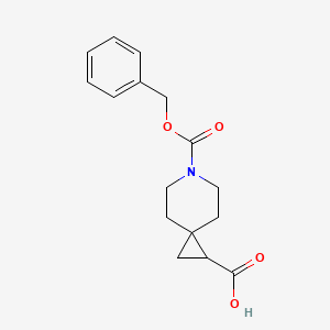 Chemical structure of 6-((Benzyloxy)carbonyl)-6-azaspiro[2.5]octane-1-carboxylic acid
