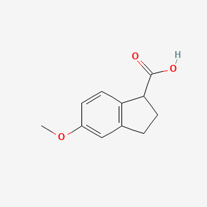 Chemical structure of 5-Methoxy-2,3-dihydro-1H-indene-1-carboxylic acid