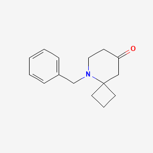 Chemical structure of 5-Benzyl-5-azaspiro[3.5]nonan-8-one
