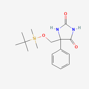 Chemical structure of 5-(((tert-Butyldimethylsilyl)oxy)methyl)-5-phenylimidazolidine-2, 4-dione