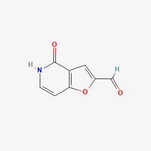 Chemical structure of 4-oxo-4H,5H-furo[3,2-c]pyridine-2-carbaldehyde