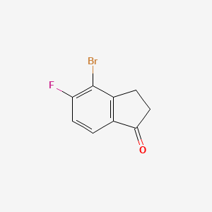 Chemical structure of 4-Bromo-5-fluoro-2,3-dihydro-1H-inden-1-one