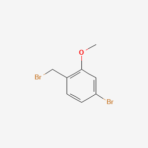 Chemical structure of 4-Bromo-1-(bromomethyl)-2-methoxybenzene