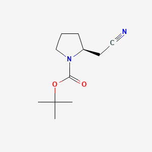 Chemical structure of (S)-tert-Butyl 2-(cyanomethyl)pyrrolidine-1-carboxylate