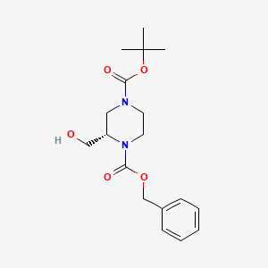 Chemical structure of (S)-1-Benzyl 4-tert-butyl 2-(hydroxymethyl)piperazine-1,4-dicarboxylate