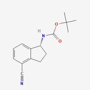 Chemical structure of (R)-tert-Butyl (4-cyano-2,3-dihydro-1H-inden-1-yl)carbamate
