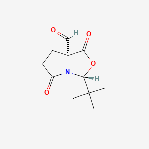 Chemical structure of (3R,7aR)-3-(tert-Butyl)-1,5-dioxohexahydropyrrolo[1,2-c]oxazole-7a-carbaldehyde